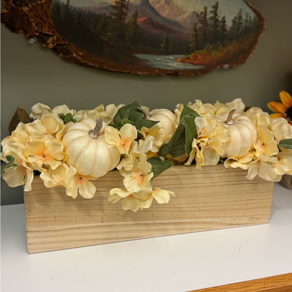 Fall pumpkin and pine cone centerpiece